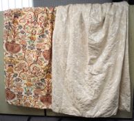 A pair of cream curtains and another