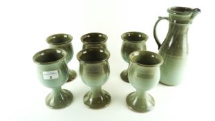 A Kiltrea Studio Art pottery set to include a jug and six goblets