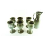 A Kiltrea Studio Art pottery set to include a jug and six goblets