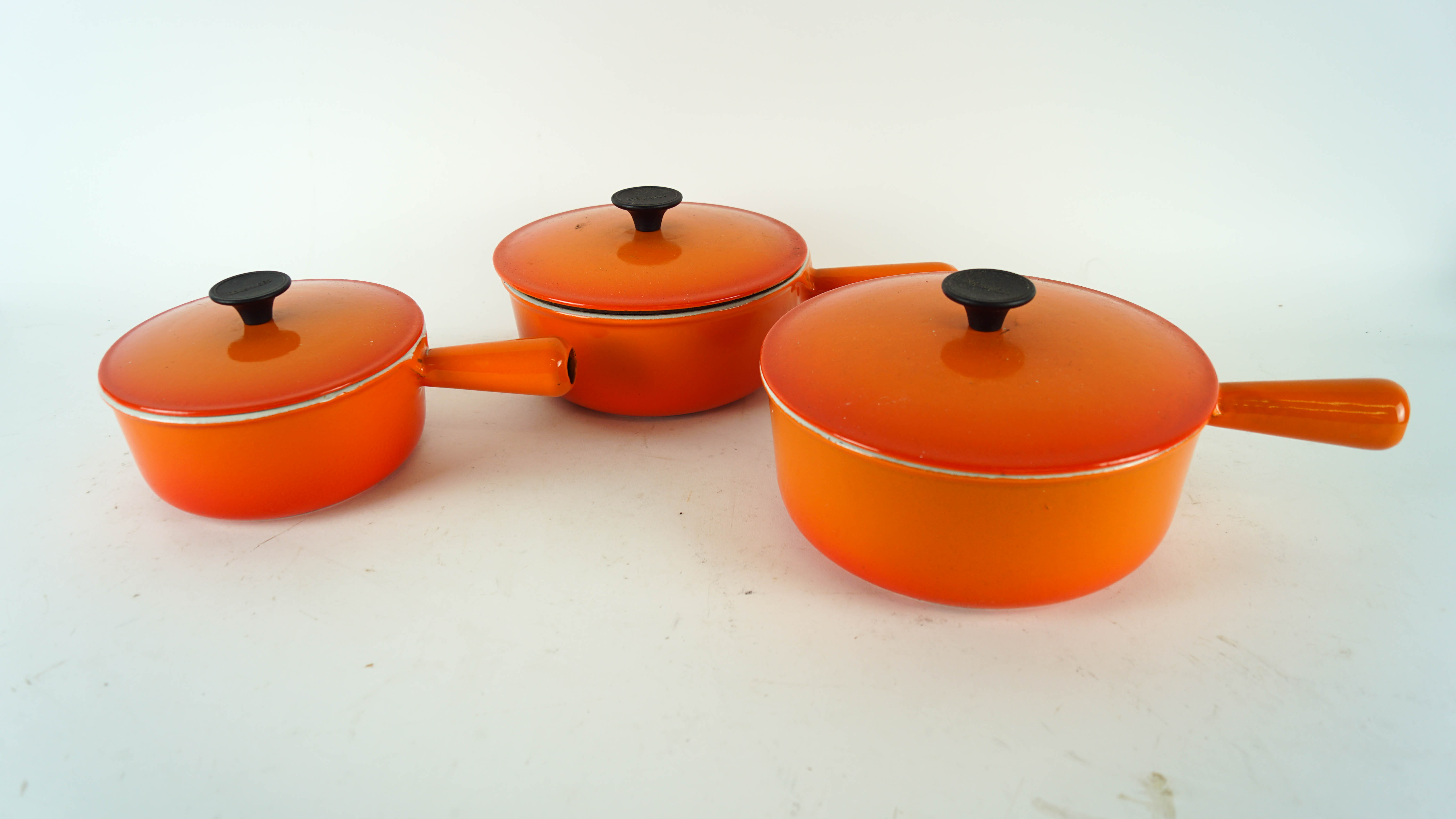 A set of three Cousances saucepans by Le Creuset,