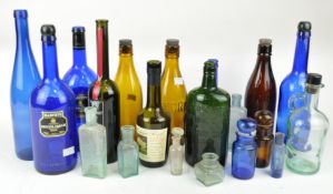 A collection of bottles and other glass