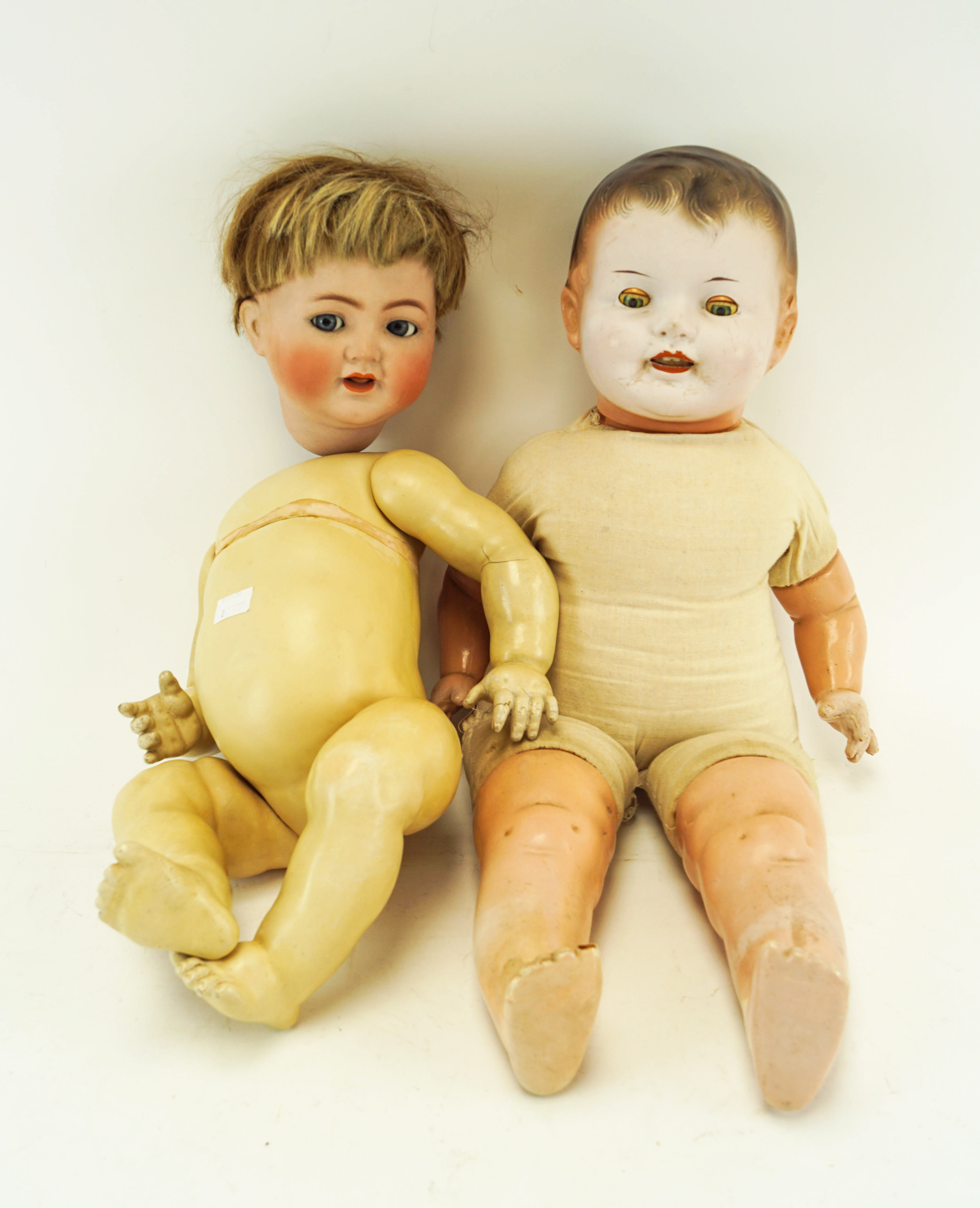 Two antique bisque dolls, one stamped 126 and 56 to neck,