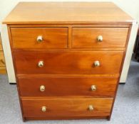 A mahogany chest of two short and three long drawers with brass handles