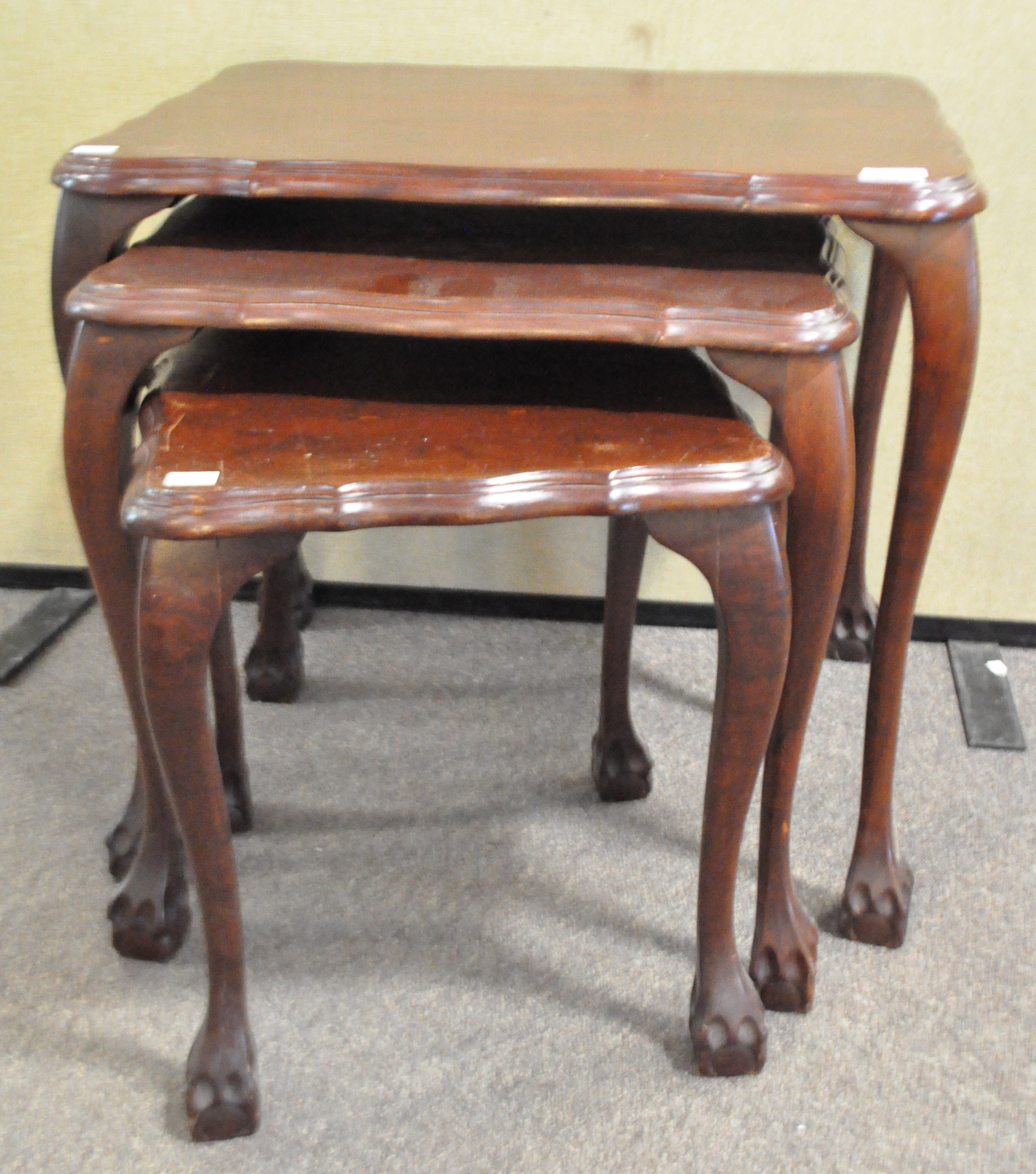 A mahogany nest of three tables