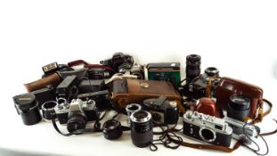 A group of cameras and lenses,