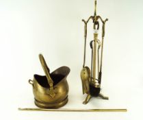 A brass companion set,