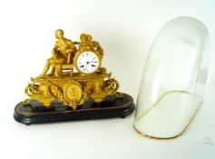 A gilt Spelter mantle clock on wooden base and dome (a/f)