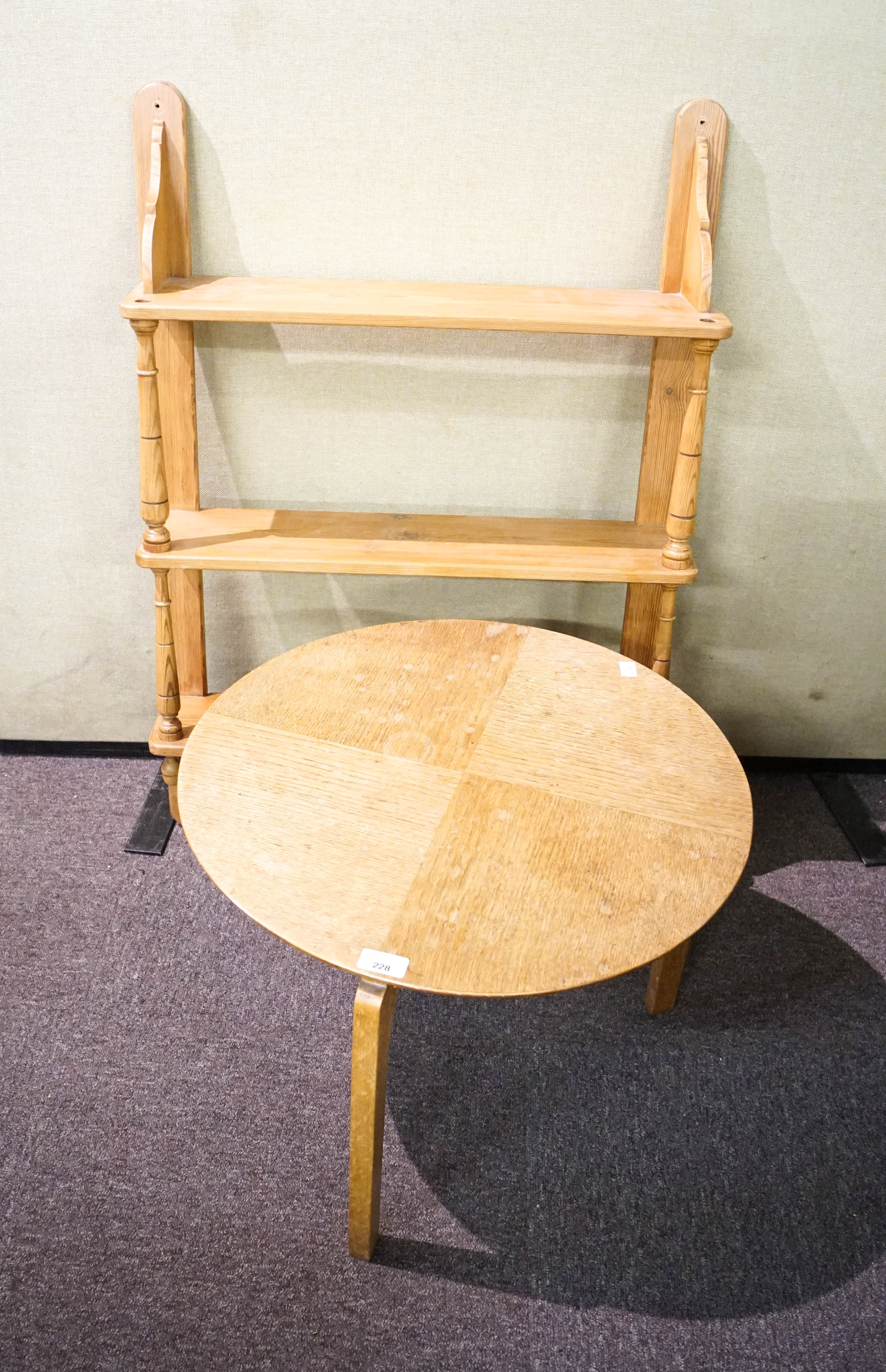 A coffee table and pine shelves