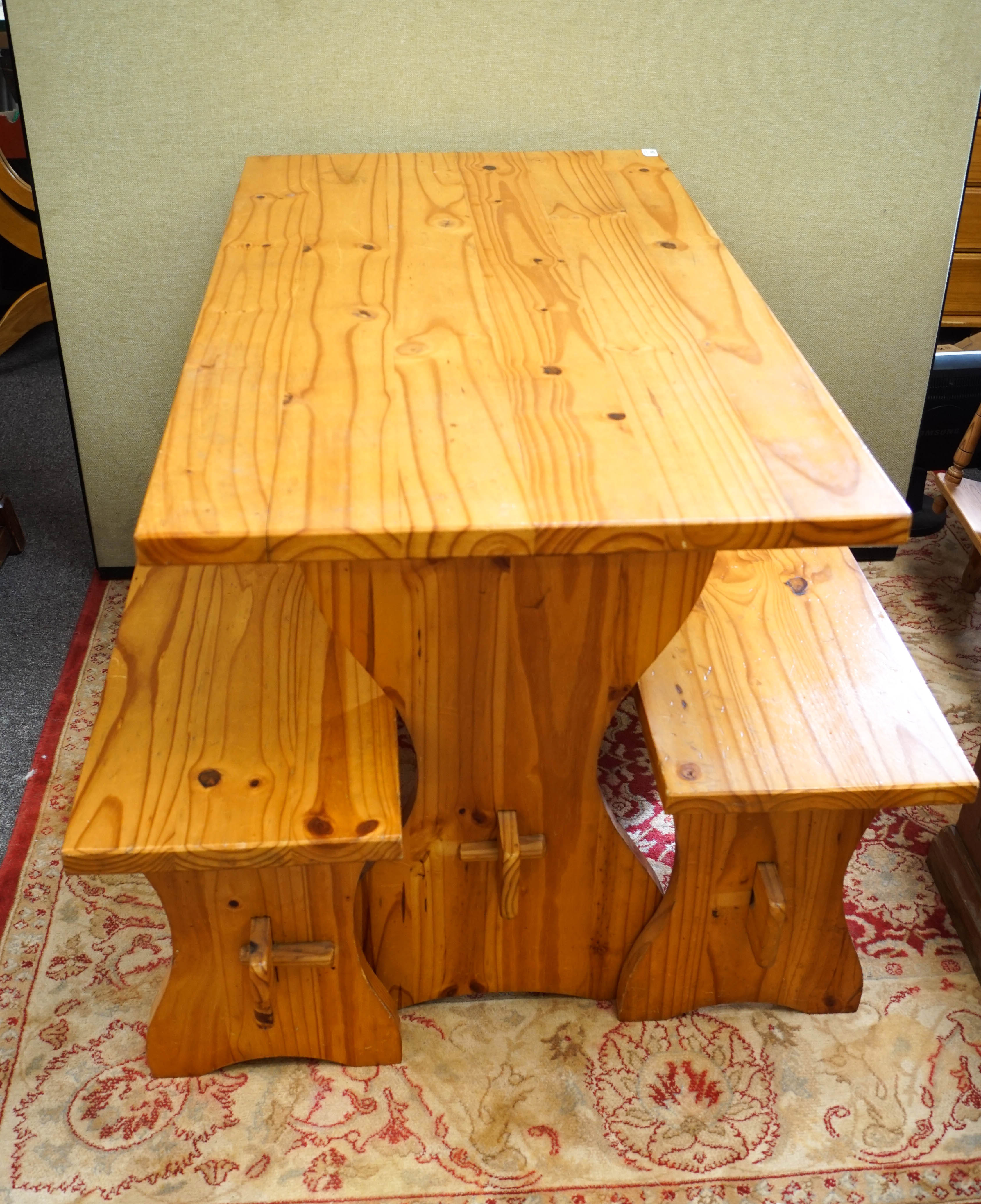 A pine table and two bench seats
