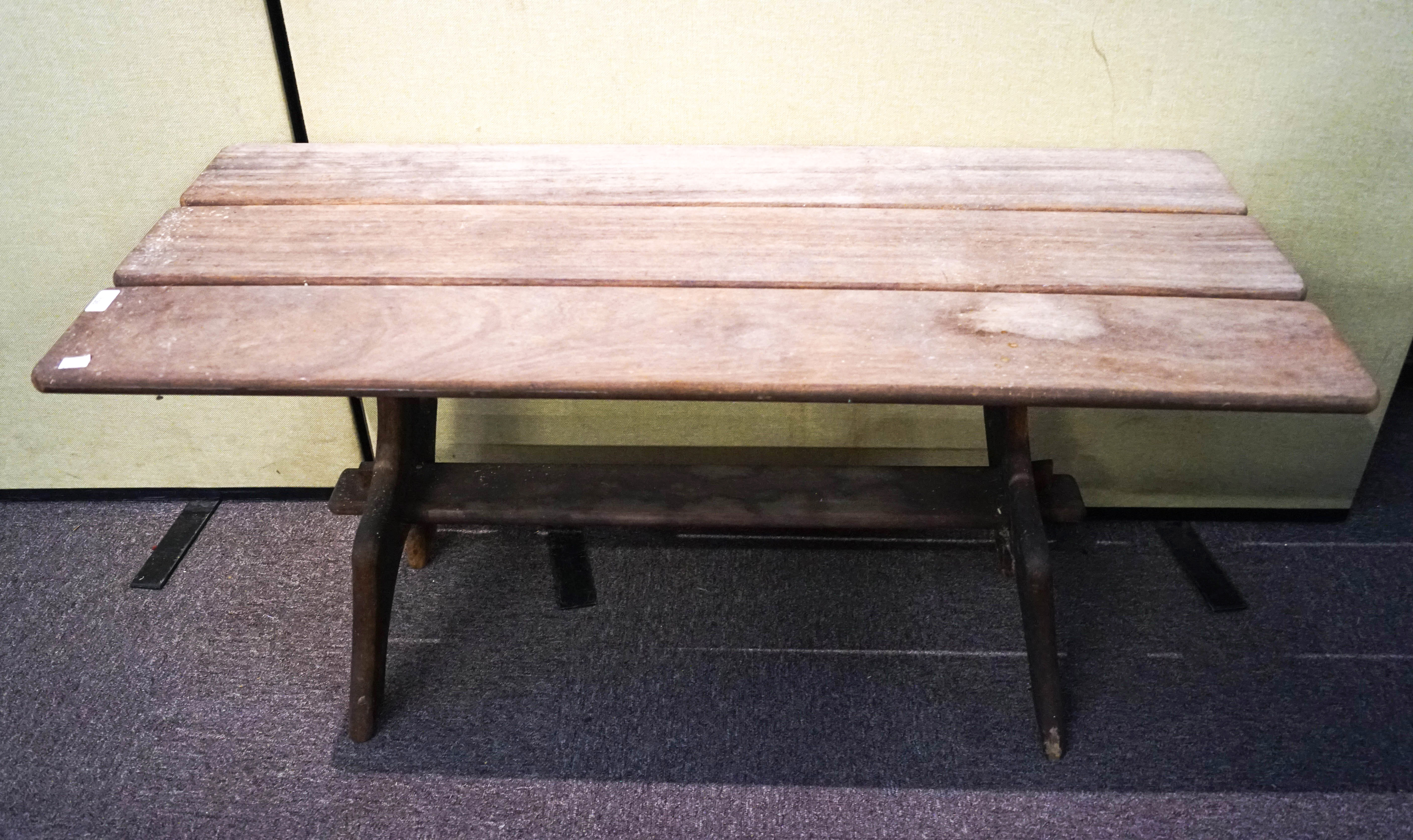 A Branson iroko wood three plank peg jointed table