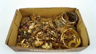 A box of gilt metal jewellery