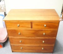 A mahogany chest of two short and three long drawers with brass handles