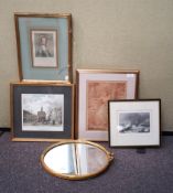 An oval mirror and pictures