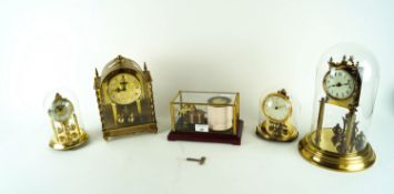 Four brass clocks and a barograph