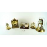 Four brass clocks and a barograph