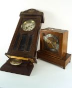 A Deco wood wall clock and a similar mantel clock