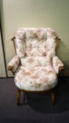 An Ercol style wide armchair