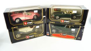 A collection of four 1:18 scale die cast model cars
