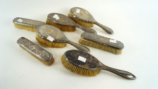 A group of silver brushes