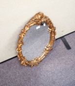 A gilt framed antique style mirror