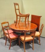 A Chinese rosewood dining table and set of seven matching chairs