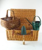 A wicker hamper and basket with other items
