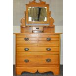 A dressing chest having vanity drawer and mirror back