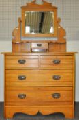 A dressing chest having vanity drawer and mirror back