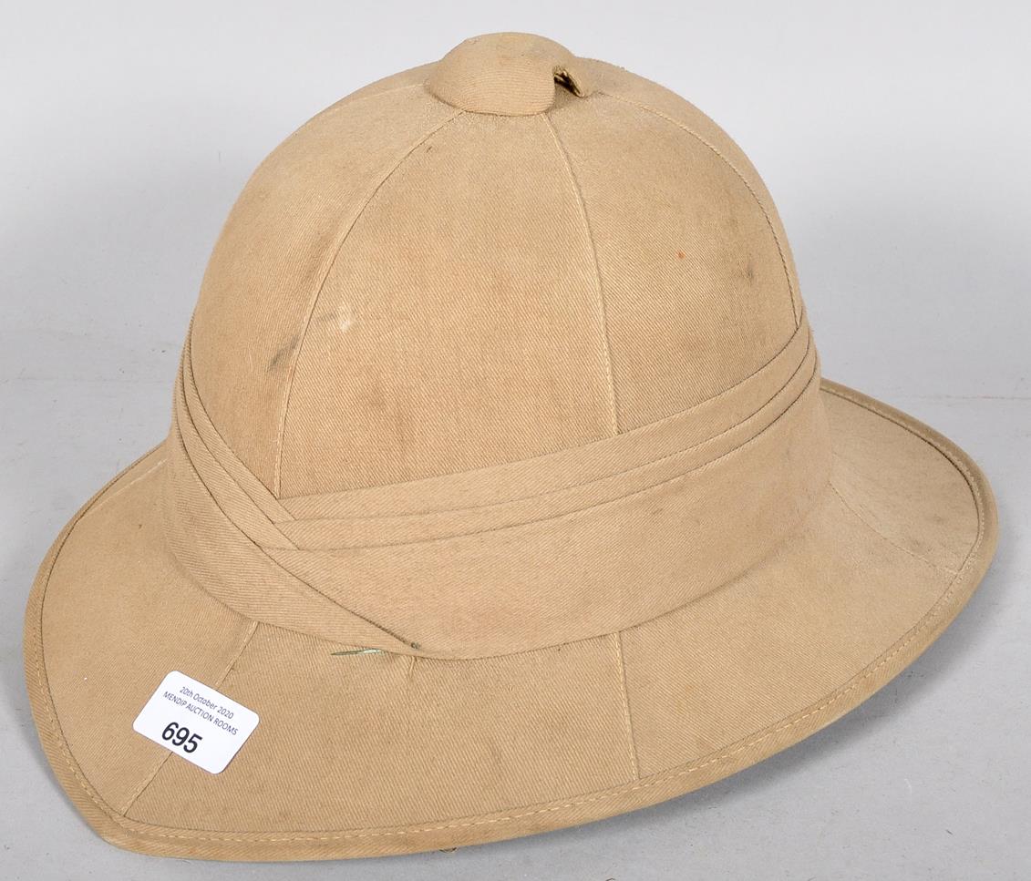 A WWII Second World War era Pith helmet with label to the inside.