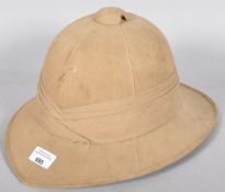 A WWII Second World War era Pith helmet with label to the inside.