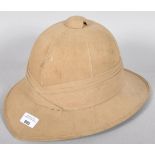 A WWII Second World War era Pith helmet with label to the inside.