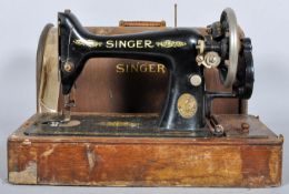 An oak cased singer sewing machine
