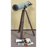 A Greenkat Astronimical Reflector Telescope on tripod along with a Japanese gun sight.