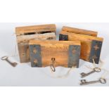 A collection of large Victorian gothic ecclesiastical lock and keys mounted to oak blocks.