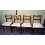 A set of four regency revival mahogany bar back chairs with drop in upholstered seats.