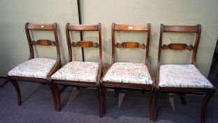 A set of four regency revival mahogany bar back chairs with drop in upholstered seats.