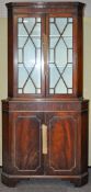 A 20th Century mahogany corner cupboard