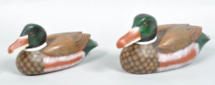 Two reproduction painted wooden decoy ducks