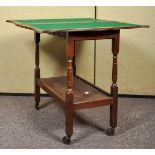 A 20th Century oak two tier trolley games table