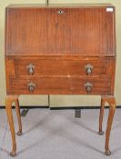 A 20th Century mahogany bureau and side table. Bureau measures; 100cm x 72cm x 42cm.