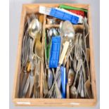 A collection of flatware cutlery having silver plate and stainless, all within a cutlery tray.