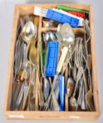 A collection of flatware cutlery having silver plate and stainless, all within a cutlery tray.