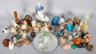 A collection of assorted figure to include Royal Copenhagen and more.