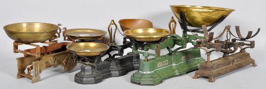 A set of four vintage cast metal and brass scales