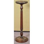 An early 20th century oak round torchere/plant stand,