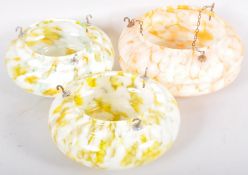 A set of three assorted 1930's Art Deco mottled glass pendant ceiling light shades