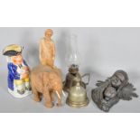 A Staffordshire Toby Jug along with figural carved wooden items and other items.