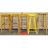 A set of three matching beech breakfast bar stools along with another two examples.