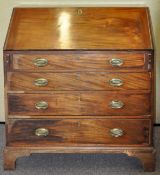 A 19th Century mahogany bureau having a fall front door revealing a fitted interior,