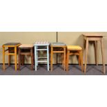 Five vintage assorted stools and an oak side table. Tallest measures; 56cm.